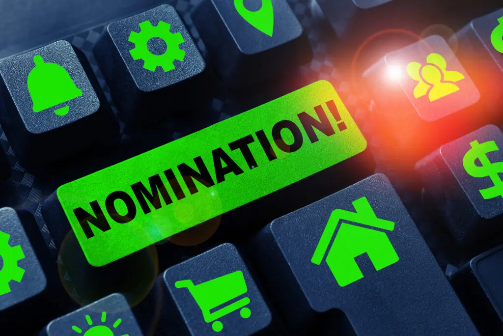 Nomination button on keyboard with icons.